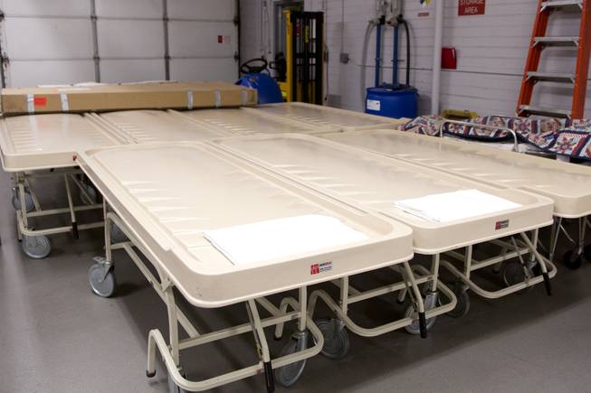 Gurneys  lined up and ready for use in the receiving of the Clark County Coroner's Office Thursday, Feb. 13, 2014.